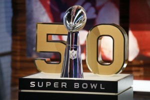 The Vince Lombardi Trophy stands n front of the No. 50, the number of the Super Bowl following the upcoming season, during a media availability at the NFL Network studios, Wednesday, Sept. 9, 2015, in Culver City, Calif. (AP Photo/Danny Moloshok)